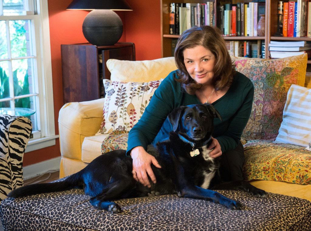 Libby's late husband, Michael Crespo, often acknowledged her love of dogs through paintings of the family's canines. Here she is pictured with Lucca.