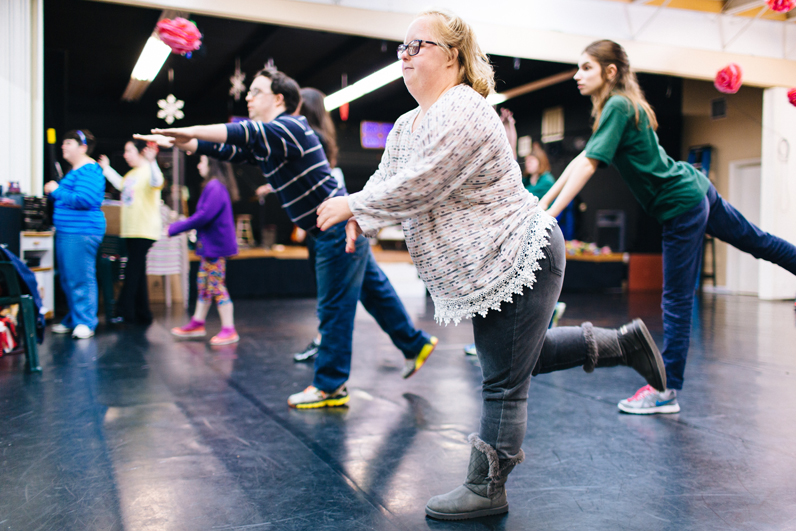 Lydia Roberts follows the choreography at a dance class designed for special-needs adults. David Landry and Megan Saffiotti are in the background. 