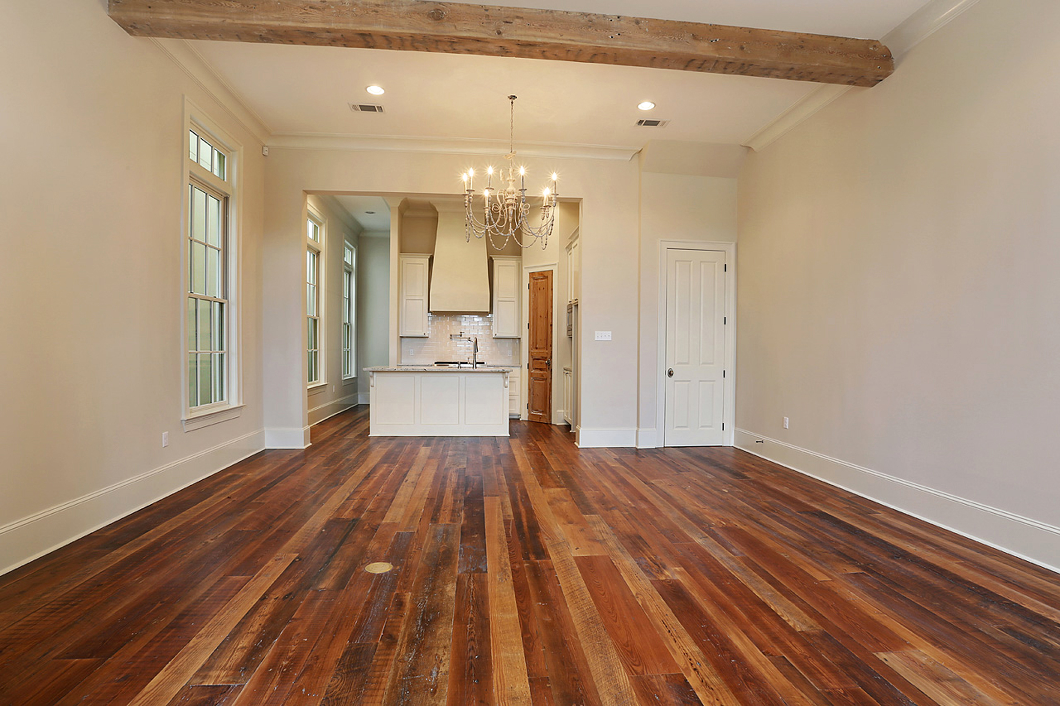 For this home in the Perkins Lane development, Holliday let features like old beams and heart-pine floors shine by keeping her palette toned down but textural.