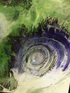 This image of the Richat Structure, a geological formation in the Maur Adrar Desert in Africa, is part of the exhibit.
