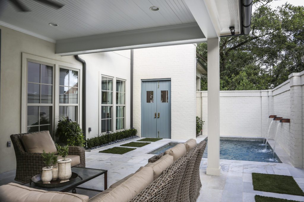 Grilling and chilling are the family’s primary pastimes when out in the courtyard, which features a beadboard ceiling and quartzite tile floor. 