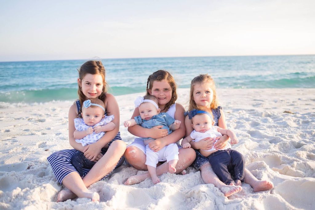 Each of the older girls is assigned one of the triplets to help look after. "Even in the womb, they had each claimed a girl," says Chrissy.