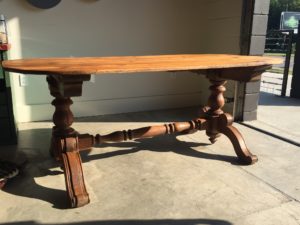 A flood-damaged table restored by Strother.