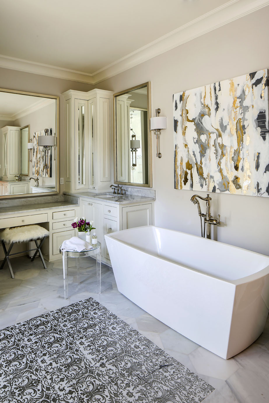 Chuck’s aunt Betsy Williamson captured the metallic hues of the master bath in an abstract painting that now hangs over the freestanding tub. Photo by Melissa Oivanki.
