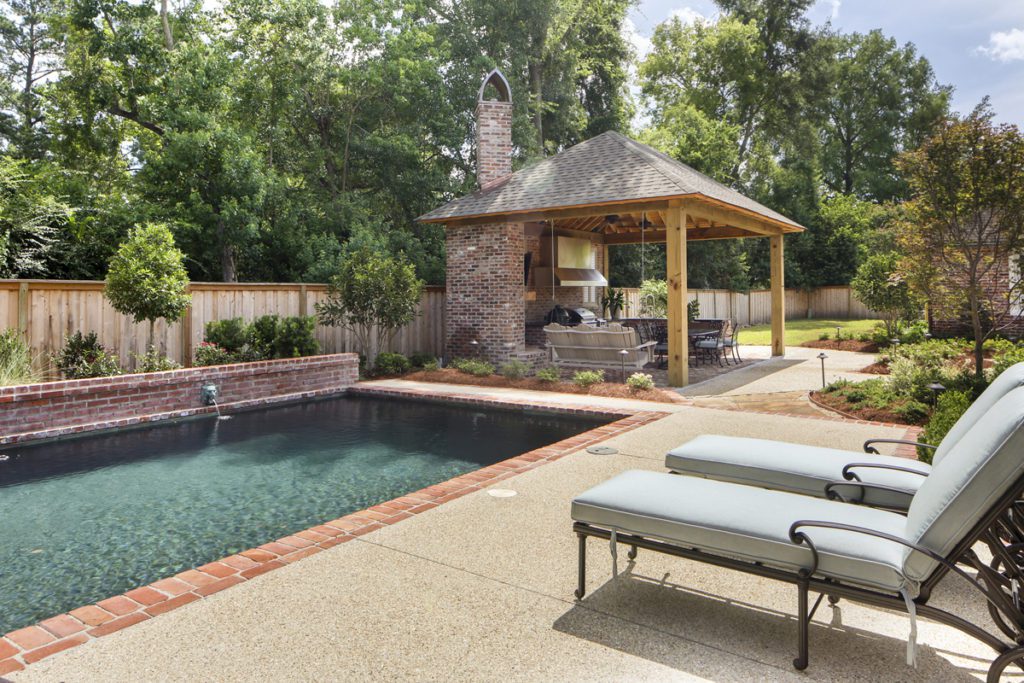 The pie-shaped lot affords the Balhoffs plenty of room for spreading out with grandchildren in the backyard. In the place where a simple pergola once stood, a new outdoor kitchen has become a favorite gathering spot for extended family. Photo by Melissa Oivanki.