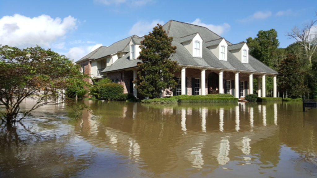 Alan Colby researched the flood of 1983—the worst water event in the area in recent times—and built his home three feet above that flood level. The family home still took in a foot of water.