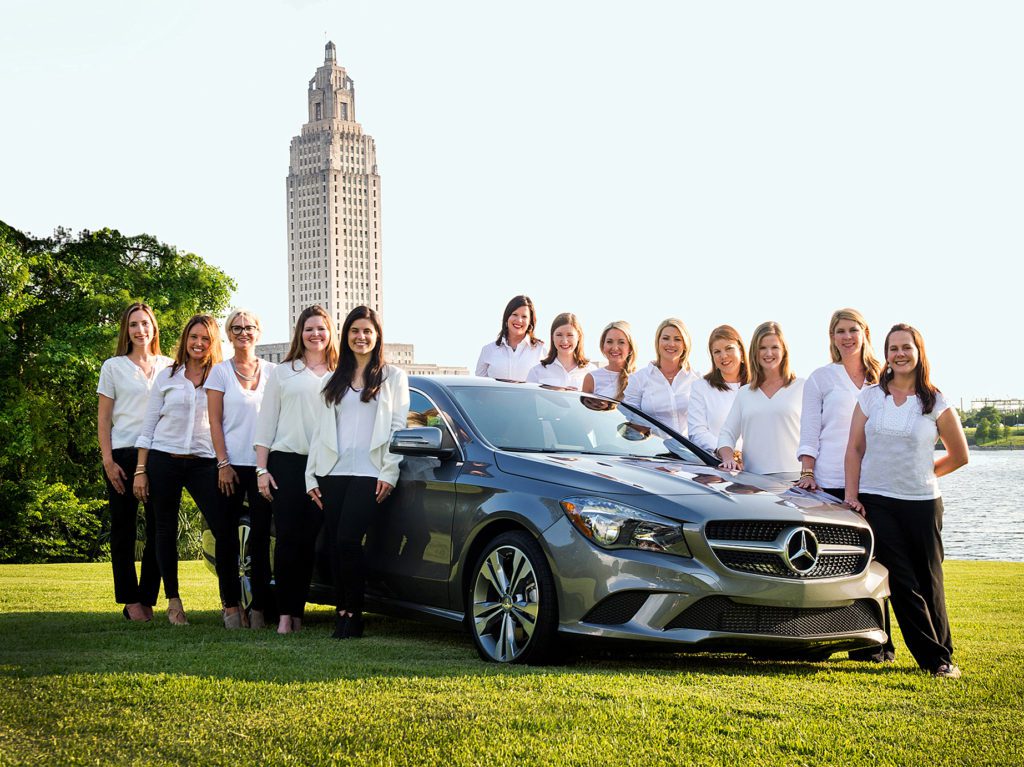 A raffle for a new car has long been an exciting part of the Hollydays fundraising effort, and a photo with the vehicle is a Hollydays committee tradition. Photo by Jeannie Frey Rhodes.