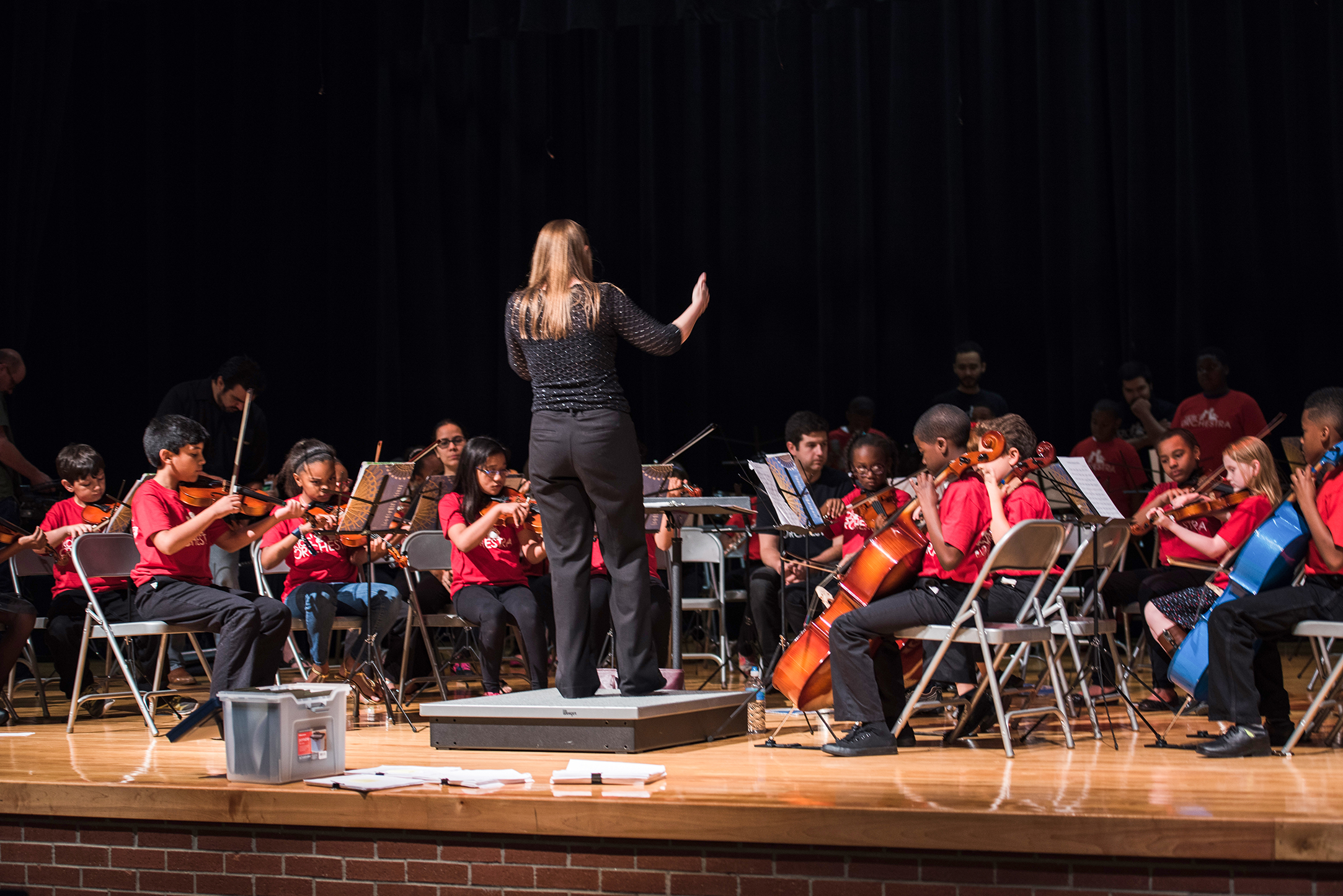 Conductor Christine Russell and other teaching artists guide the young musicians through rehearsals. Katie Barnett, Vivid Dream Photography.