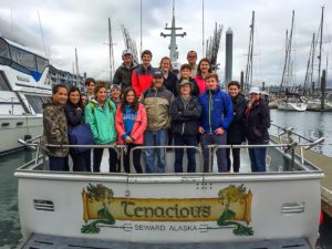 The group aboard a fishing charter boat in Seward